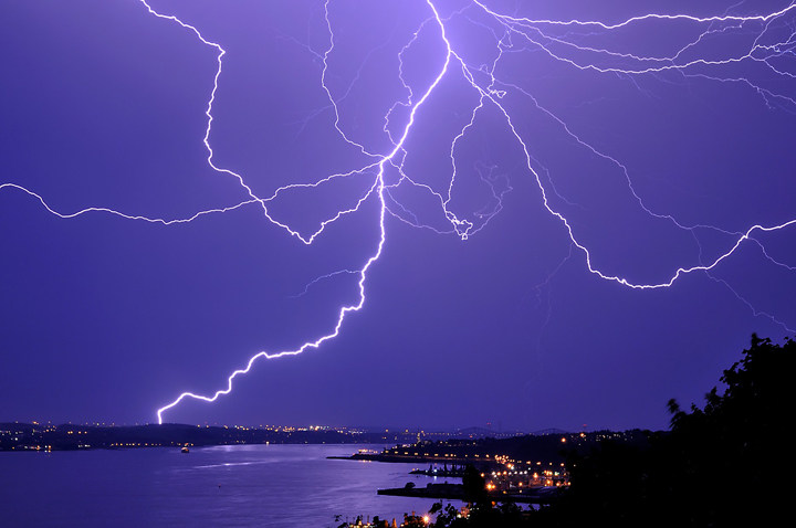 Lightning over St-Laurent River on a stormy night in Quebec.